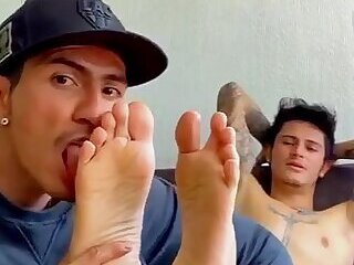 Licking his ticklish feet